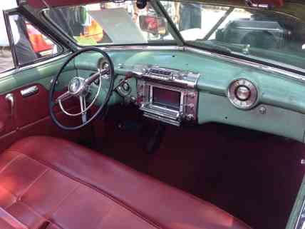 The interior of ICON's 1942-Series Buick includes a modern touch screen navigation unit