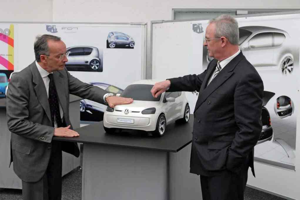 Walter de' Silva and former VW Group CEO Martin Winterkorn look over a scale model of the VW Up! study